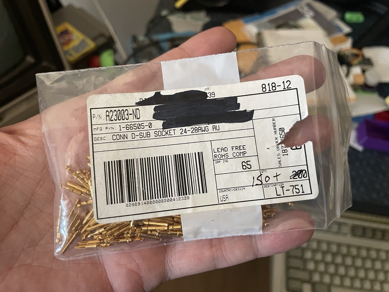 A bag of gold plated D-sub push-in contacts. A bag of gold plated D-sub push-in contacts.